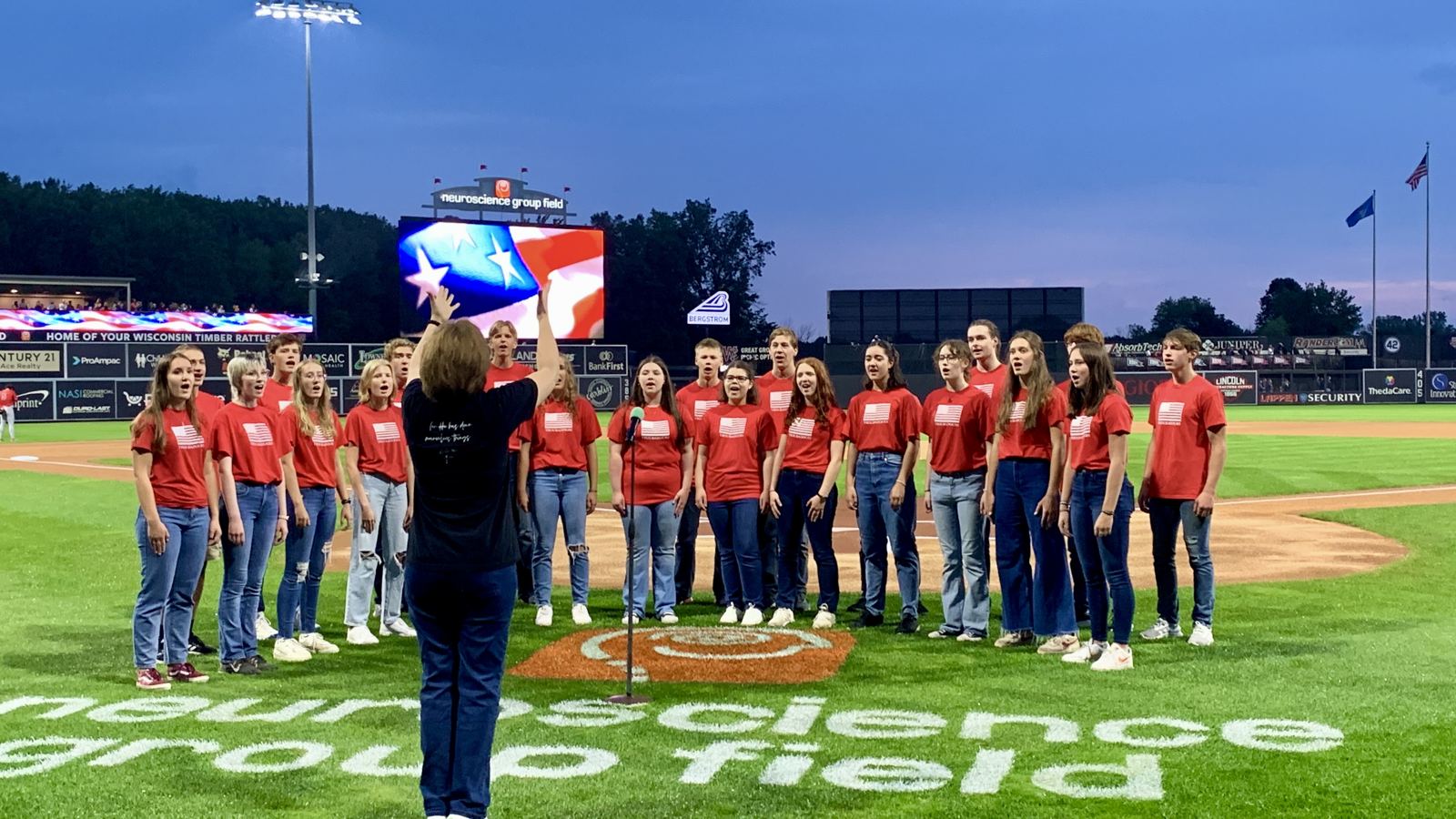 Valley Troubadours singers performing the anthem at a ballpark